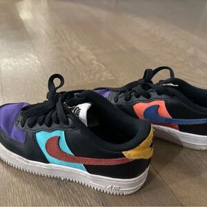 Nike Sneakers with Red, Blue, and Yellow Accents